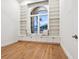 Comfortable reading nook with built-in shelving, storage, and a window seat at 1575 Eastbrook Dr, Sarasota, FL 34231