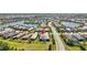 Aerial view of home in a tranquil neighborhood near a lake, offering serene views and community charm at 17042 Hampton Falls Ter, Bradenton, FL 34202