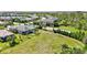 Spacious backyard showcasing a large lot with manicured lawn and mature landscaping, perfect for outdoor activities at 17042 Hampton Falls Ter, Bradenton, FL 34202