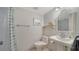 Cozy bathroom with a vanity, toilet, and shower with nice nautical decor at 1711 Southwood St # 1711, Sarasota, FL 34231