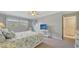 Comfortable bedroom with soft carpet, white furniture, a ceiling fan, and natural lighting at 1711 Southwood St # 1711, Sarasota, FL 34231