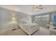 Light-filled bedroom with a ceiling fan, soft carpet, and natural light from a window at 1711 Southwood St # 1711, Sarasota, FL 34231