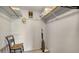This walk-in closet features a grey carpet, along with organizers and a chair at 1711 Southwood St # 1711, Sarasota, FL 34231