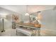 Cozy dining area featuring a dining table with bench seating and a decorative mirror at 1711 Southwood St # 1711, Sarasota, FL 34231
