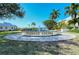 A charming fountain feature at the entrance to Baywood Colony adds a touch of elegance and welcomes visitors at 1711 Southwood St # 1711, Sarasota, FL 34231