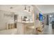 Modern kitchen with stainless steel appliances, granite countertops, and bar seating at 1711 Southwood St # 1711, Sarasota, FL 34231