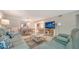 Spacious living room with comfortable seating and a view of the kitchen and dining area at 1711 Southwood St # 1711, Sarasota, FL 34231