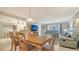 Open-concept living and dining area, featuring tile floors and ample seating space at 1711 Southwood St # 1711, Sarasota, FL 34231