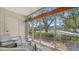 Cozy sunroom featuring comfortable seating and scenic views of the surrounding landscape at 1711 Southwood St # 1711, Sarasota, FL 34231