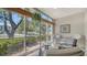Relaxing sunroom with large windows, perfect for enjoying the natural light and outdoor views at 1711 Southwood St # 1711, Sarasota, FL 34231