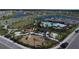 Aerial view of the community with a pool, clubhouse, playground, sidewalks, pond and sports fields at 177 Tierra Verde Way, Bradenton, FL 34212