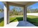 View of a well-maintained backyard from a shaded back porch at 177 Tierra Verde Way, Bradenton, FL 34212