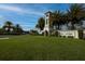 Elegant community entrance sign for Del Tierra surrounded by mature palm trees at 177 Tierra Verde Way, Bradenton, FL 34212