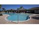 Inviting community pool with clear blue water, lounge chairs, and covered seating areas for a perfect day of relaxation at 177 Tierra Verde Way, Bradenton, FL 34212