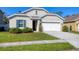 Charming single-story home with an attached two car garage and well-kept landscaping at 177 Tierra Verde Way, Bradenton, FL 34212