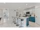 Spacious kitchen with an island, bar stool seating, and bright, modern decor at 177 Tierra Verde Way, Bradenton, FL 34212