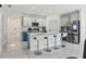 Modern kitchen with a large island, white countertops, and stainless steel appliances at 177 Tierra Verde Way, Bradenton, FL 34212