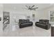 Bright living area with sleek tile flooring, modern furniture, and ceiling fan at 177 Tierra Verde Way, Bradenton, FL 34212