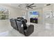 Comfortable living room with large TV, tile flooring, and comfortable seating at 177 Tierra Verde Way, Bradenton, FL 34212