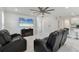 Open-concept living space with kitchen, TV, tile flooring, and comfortable seating at 177 Tierra Verde Way, Bradenton, FL 34212