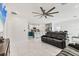 Spacious, open-concept living area with a kitchen, a ceiling fan, and a comfortable seating area at 177 Tierra Verde Way, Bradenton, FL 34212