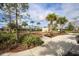 Charming community playground with swings, climbing features, and lush landscaping for outdoor enjoyment at 177 Tierra Verde Way, Bradenton, FL 34212