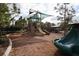 Community playground features shaded play area with a slide, climbing wall and green seating at 177 Tierra Verde Way, Bradenton, FL 34212