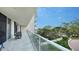 Condo balcony with an open view, plenty of natural light, and outdoor furniture and access to the inside at 1800 Benjamin Franklin Dr # B208, Sarasota, FL 34236