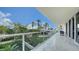 Lovely condo balcony with an outdoor view, plenty of natural light, great outdoor furniture, and open space at 1800 Benjamin Franklin Dr # B208, Sarasota, FL 34236