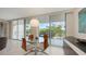 Bright dining area boasts views from sliding glass doors; perfect for entertaining at 1800 Benjamin Franklin Dr # B208, Sarasota, FL 34236