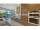 Modern kitchen features sleek cabinets, stainless steel appliances, and a breakfast area with outdoor views at 1800 Benjamin Franklin Dr # B208, Sarasota, FL 34236