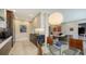 Contemporary open kitchen concept boasts an island, stainless steel appliances, and custom cabinetry at 1800 Benjamin Franklin Dr # B208, Sarasota, FL 34236