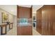 Well-equipped laundry room with modern washer and dryer, plenty of counter space, and storage cabinets at 1800 Benjamin Franklin Dr # B208, Sarasota, FL 34236