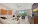 An open living space with modern decor, ample light, beautiful furniture and a clear view of the outdoors at 1800 Benjamin Franklin Dr # B208, Sarasota, FL 34236