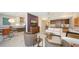 Bright living room with stylish furnishing next to a dining area with a contemporary kitchen at 1800 Benjamin Franklin Dr # B208, Sarasota, FL 34236