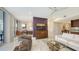 An open-concept living room with combined dining area and modern kitchen for seamless entertaining at 1800 Benjamin Franklin Dr # B208, Sarasota, FL 34236