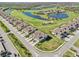 Overhead view of an upscale neighborhood, golf course, and lake, showcasing the community layout at 18117 Gawthrop Dr # 101, Lakewood Ranch, FL 34211