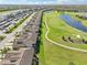 Birds eye view of the long, winding golf course between the houses of the beautiful community at 18117 Gawthrop Dr # 101, Lakewood Ranch, FL 34211