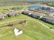 Stunning aerial view of condos on a golf course with water features and beautiful landscaping at 18117 Gawthrop Dr # 101, Lakewood Ranch, FL 34211