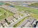 Scenic aerial view of a well-planned community featuring golf courses, lakes, and lush landscaping at 18117 Gawthrop Dr # 101, Lakewood Ranch, FL 34211