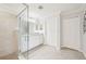 Well-lit bathroom featuring a glass-enclosed shower, vanity with granite countertop, and neutral color palette at 18117 Gawthrop Dr # 101, Lakewood Ranch, FL 34211
