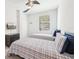 Bedroom featuring two beds, a ceiling fan, TV, and a window with views of the exterior at 18117 Gawthrop Dr # 101, Lakewood Ranch, FL 34211