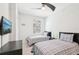 Bedroom featuring two beds, a ceiling fan, TV, and a window with views of the exterior at 18117 Gawthrop Dr # 101, Lakewood Ranch, FL 34211