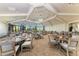 Large dining hall with neutral decor, stylish furnishings and plenty of natural light at 18117 Gawthrop Dr # 101, Lakewood Ranch, FL 34211