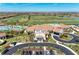 An exterior view of the clubhouse showcasing its classic architecture and lovely landscaping at 18117 Gawthrop Dr # 101, Lakewood Ranch, FL 34211