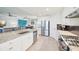 Modern kitchen boasts granite counters, stainless steel appliances, and an open layout at 18117 Gawthrop Dr # 101, Lakewood Ranch, FL 34211