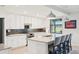Stylish kitchen with a granite island, pendant lighting, and modern appliances at 18117 Gawthrop Dr # 101, Lakewood Ranch, FL 34211