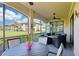 Relaxing screened lanai with comfortable seating and pleasant outdoor views at 18117 Gawthrop Dr # 101, Lakewood Ranch, FL 34211