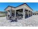 An outdoor bar and seating area for entertainment at 18117 Gawthrop Dr # 101, Lakewood Ranch, FL 34211