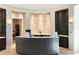 Inviting reception area with a curved desk, elegant decor, and shelving for a professional welcome at 18117 Gawthrop Dr # 101, Lakewood Ranch, FL 34211